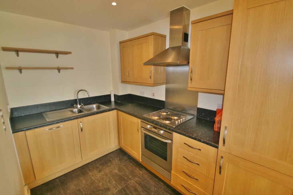 Fitted kitchen with oak cabinetry