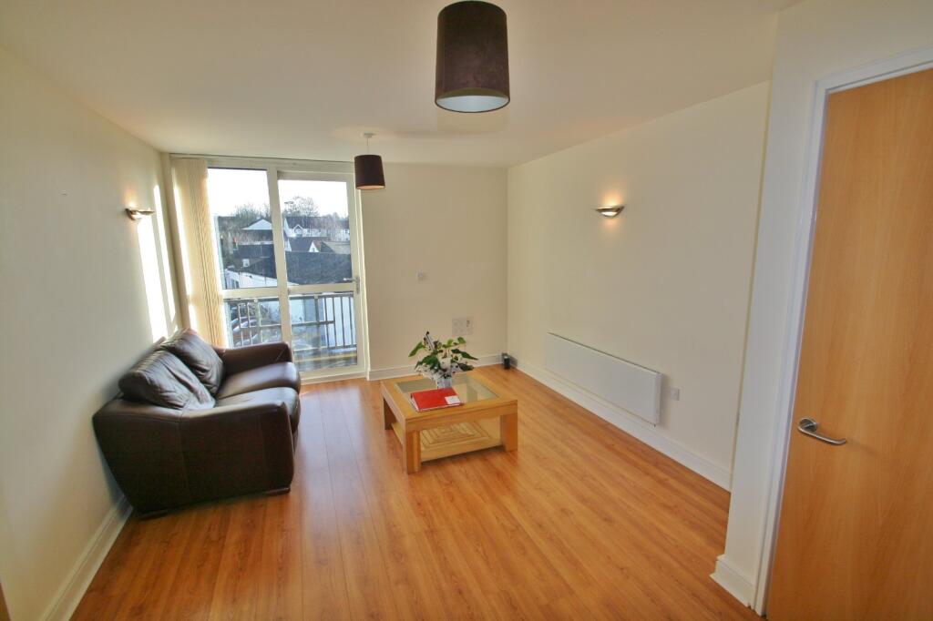 Bright lounge with doors toward the river view